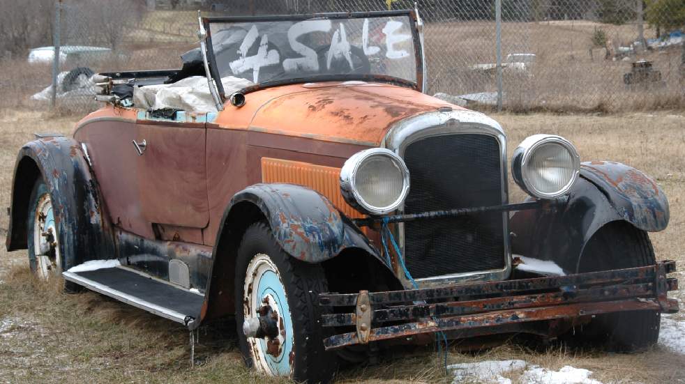 Rusty old convertible car